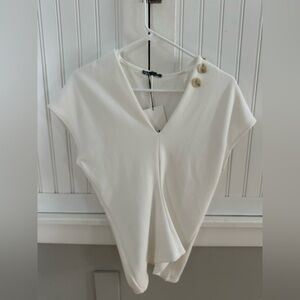 Zara Soft Pique Top-White with Button details.
New with tags in women’s small!